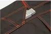A close-up view of a pocket on a pair of work pants, with a folding ruler inside. Produktbild-Vorschau