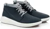 A pair of navy blue Timberland chukka boots with white soles, shown from a side-angle on a white background. Produktbild-Vorschau
