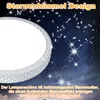 A close-up of a ceiling light with a starry sky design against a dark, star-filled background. Produktbild-Vorschau