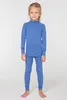 A young girl stands facing the camera, wearing a blue long-sleeved shirt and matching leggings. Náhľad obrázku produktu