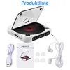 A white portable CD player with a CD inside, along with accessories like headphones, a USB cable, and a manual. Produktbild-Vorschau