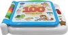 A Vtech 80-601504 Mein 100-Wörter-Buch toy is shown from a slightly elevated front-side angle against a white background. The toy is open, displaying colorful illustrations and text. Voir les images du produit
