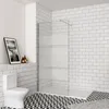 A modern bathroom with a toilet, shower enclosure, and decorative floor tiles. Produktbild-Vorschau