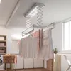 A laundry room with a ceiling-mounted electric clothes dryer. Náhľad obrázku produktu