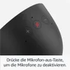A close-up view of the top of a black smart speaker, showing several buttons and a microphone icon. Produktbild-Vorschau
