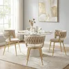 A dining set with four chairs and a round table in a well-lit room. Produktbild-Vorschau