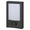 A dark gray LED outdoor light fixture with a white light panel and a black sensor. Produktbild-Vorschau