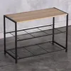 A shoe rack with a wooden top and two metal shelves against a concrete wall. Náhled obrázku produktu