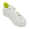 A white Superga sneaker with a yellow accent on the heel. Produktbild-Vorschau