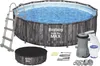 An above-ground swimming pool set with accessories, including a ladder, pump, filter, and cover. Anteprima dell’immagine prodotto