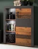 A stylish cabinet with a sliding door, displaying books and decorative items on its shelves. The cabinet features a mix of wood and dark gray elements, giving it a modern industrial look. A Route 66 sign is visible on top of the cabinet. Produktbild-Vorschau