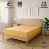 A yellow fitted sheet is shown on a wooden bed frame in a bedroom setting. Produktbild-Vorschau