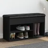 A black shoe bench with storage compartments, displaying various shoes. Podgląd zdjęcia produktu