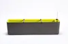 A long, rectangular planter box with a gray exterior and a bright green interior, set against a white background. A small glass tube, likely a water level indicator, is visible on the right side. Náhled obrázku produktu