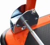 A close-up view of a metal mechanism with a spring on an orange platform. Náhled obrázku produktu