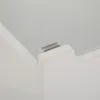 A close-up view of a white wooden storage box, showing a small detail on its corner. Produktbild-Vorschau