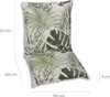 A chair cushion with a tropical leaf pattern is shown with dimensions indicated. Produktbild-Vorschau