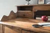 A close-up view of a wooden desk with a drawer, an apple, and scissors. Produktbild-Vorschau