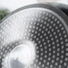 Close-up view of the textured bottom of a frying pan. Náhled obrázku produktu
