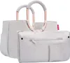 A light gray tote bag with rose gold handles and a matching pouch. Podgląd zdjęcia produktu