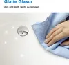 A hand is wiping a white sink with a blue cloth, showing its smooth surface and shine. Produktbild-Vorschau