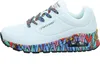 A side view of a white Skechers sneaker with colorful accents on the laces and sole. Voir les images du produit