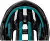 Close-up view of the inside of a black bicycle helmet with teal padding. Produktbild-Vorschau