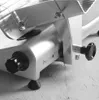 A close-up view of the side and front of a commercial meat slicer. Náhľad obrázku produktu