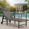 A lounge chair and small table are set up on a wooden deck next to a swimming pool. Náhled obrázku produktu