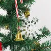 Close-up of Christmas tree decorations including a snowflake, candy cane, and bell. Anteprima dell’immagine prodotto