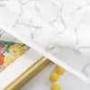 A close-up view of a white sheer curtain with a branch pattern, partially covering a framed artwork of colorful flowers and three lemons. Produktbild-Vorschau