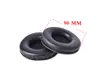 Two black ear pads for headphones are shown on a white background. A red line indicates a measurement of 90 MM. Produktbild-Vorschau