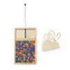 A wooden game with colorful discs and a drawstring bag on a white background. Produktbild-Vorschau