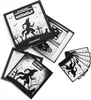 A board game box and cards are spread out on a white surface. Anteprima dell’immagine prodotto