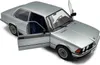 A silver BMW 323I E21 model car with its doors open, displayed on a white background. Anteprima dell’immagine prodotto