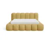 A yellow upholstered bed frame with a white mattress on a white background. Voir les images du produit