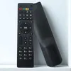 A black remote control is leaning against a white surface. Produktbild-Vorschau