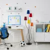 A child's desk area with a lamp, backpack, and whiteboard. Produktbild-Vorschau
