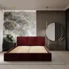 A bedroom scene featuring a bed, dresser, and mirror. Podgląd zdjęcia produktu