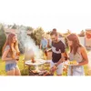 People enjoying a barbecue in a backyard setting. Voir les images du produit