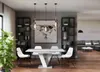A modern dining room with a table, chairs, and shelving units. Produktbild-Vorschau