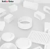 A collection of white ventilation components arranged on a light gray surface. Náhľad obrázku produktu
