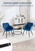 Two blue velvet chairs and a coffee table in a living room setting, with a cabinet in the background. Náhľad obrázku produktu