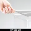 A hand is shown opening the hinged lid of a clear storage box. Produktbild-Vorschau