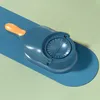 A blue and orange dumpling maker is shown on a blue surface with a light green background. Podgląd zdjęcia produktu