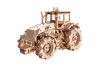 A wooden model tractor on a white background. Anteprima dell’immagine prodotto