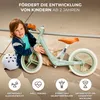 A child is sitting with a balance bike, with icons and text describing the product's benefits. Náhľad obrázku produktu