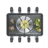 An overhead view of a raclette grill with food items. Náhľad obrázku produktu