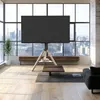 A modern living room with a large window overlooking a city skyline, featuring a TV on a tripod stand. Produktbild-Vorschau