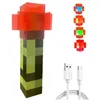A Minecraft-themed torch lamp with a USB charging cable and several interchangeable colored tops. Náhled obrázku produktu